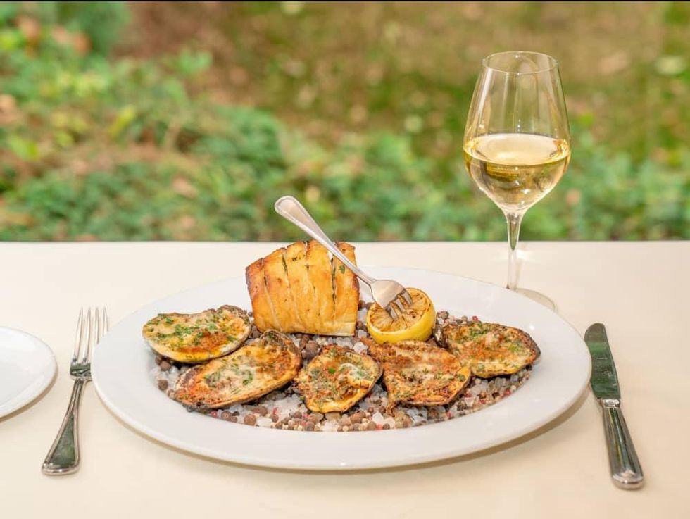 Wood-fired Gulf oysters at Tribute