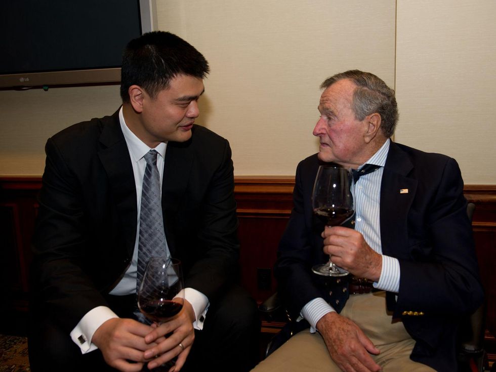 Yao Ming, left, and President George H.W. Bush at the George Bush Presidential Library Foundation dinner December 2013