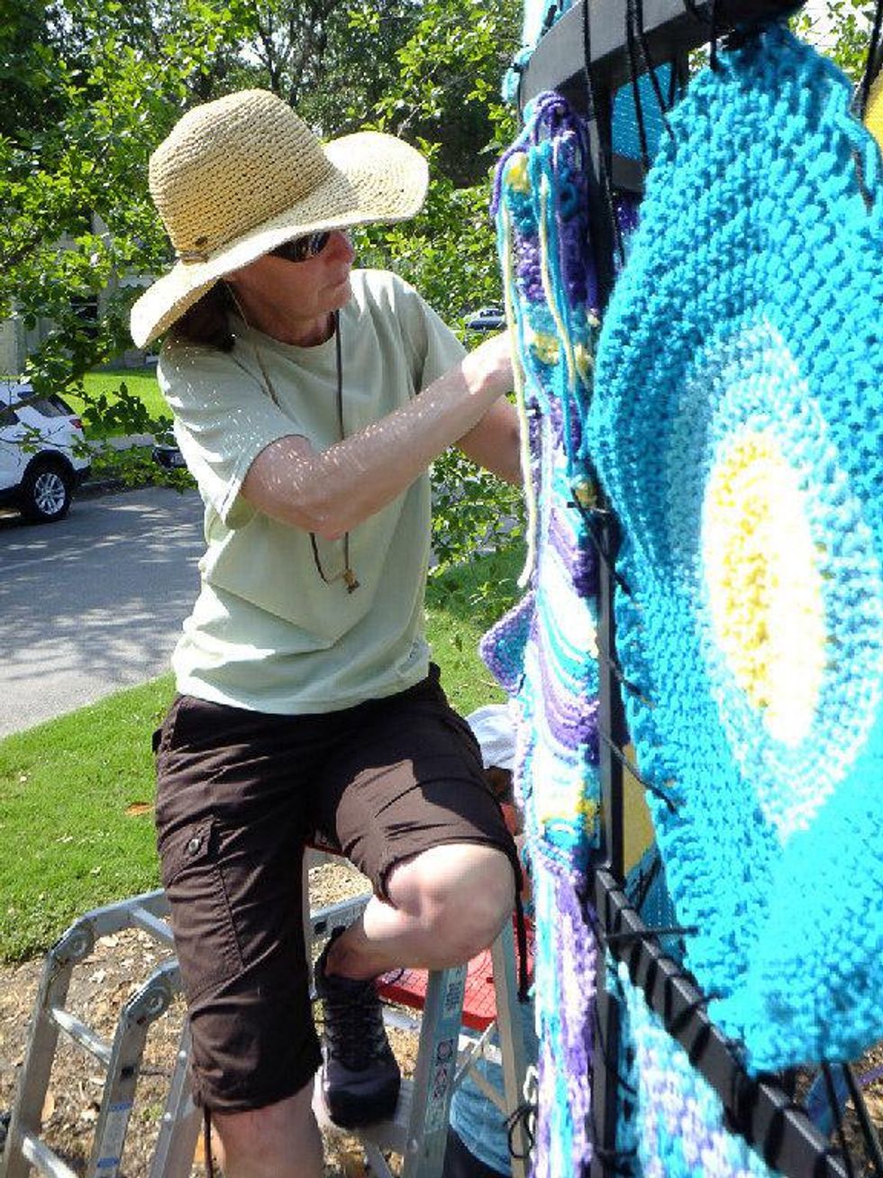 Yarnbombing Houston Heights June 2013 woman on ladder