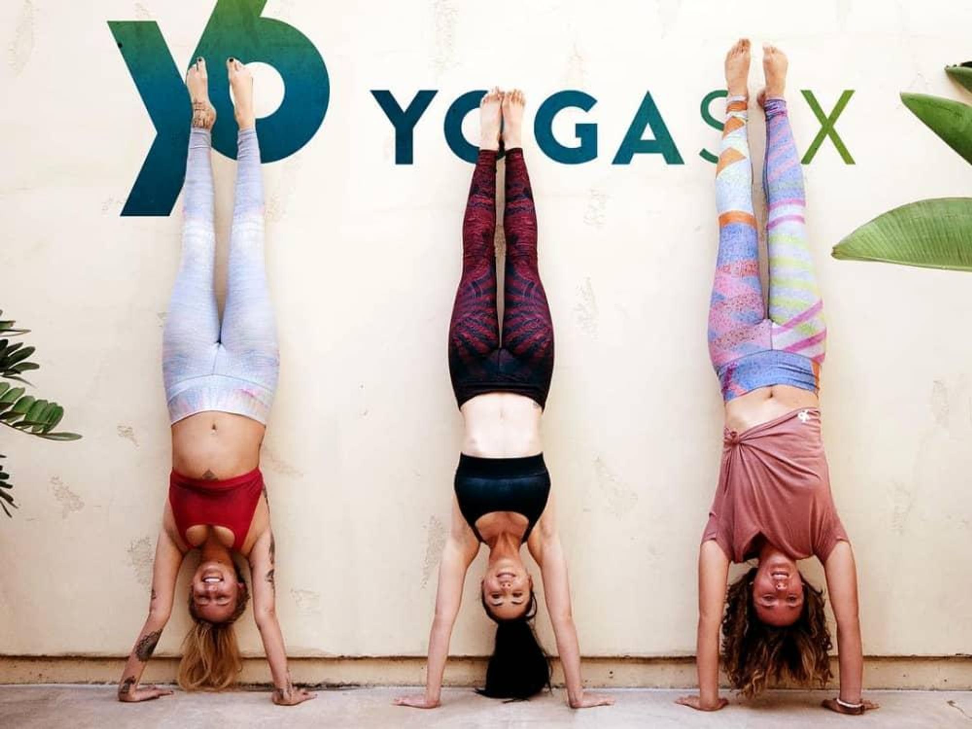 Yoga women upside down post Yoga Six hand stand